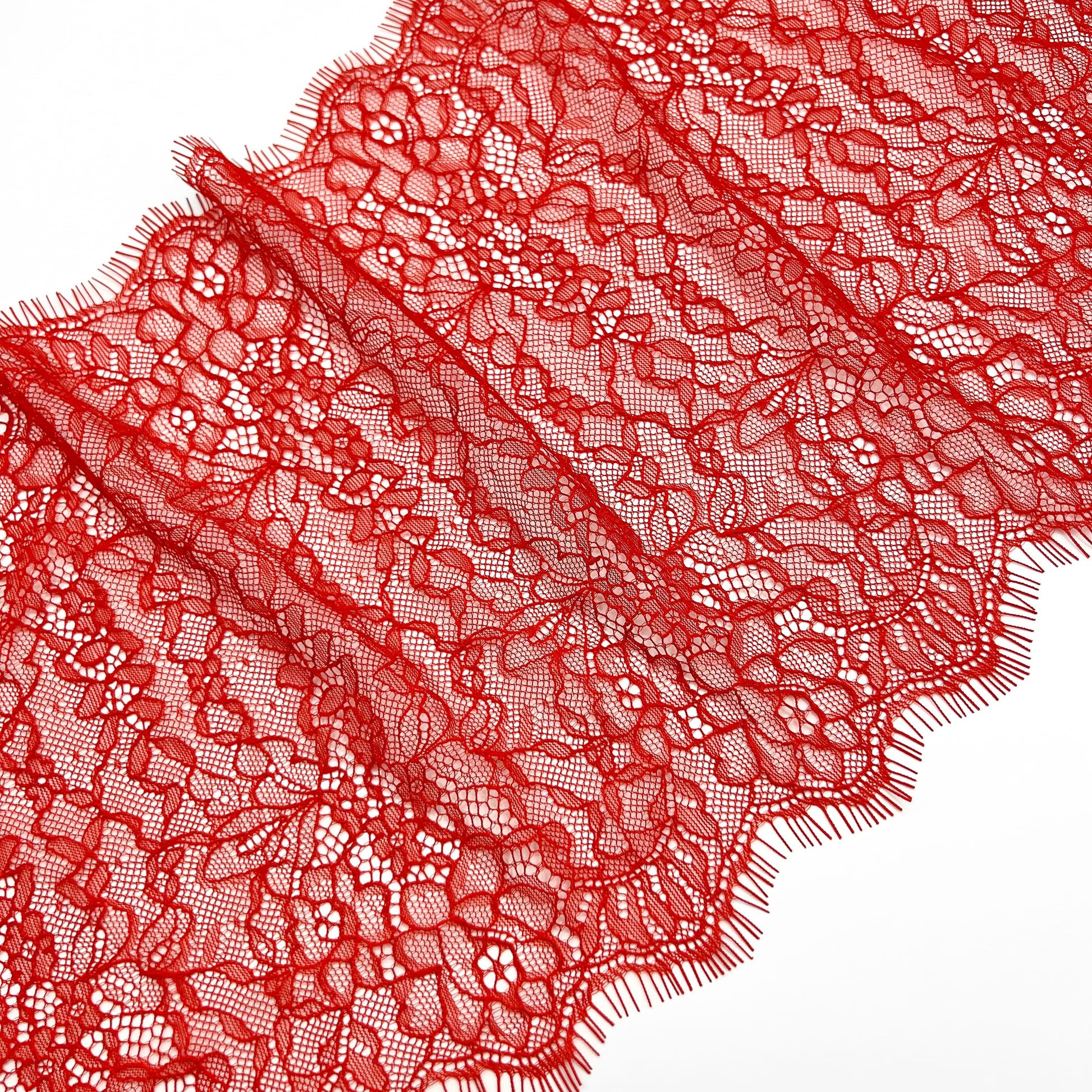 Folded 22 cm red Chantilly lace with intricate floral patterns, ideal for adding elegance to lingerie, apparel, and accessories.