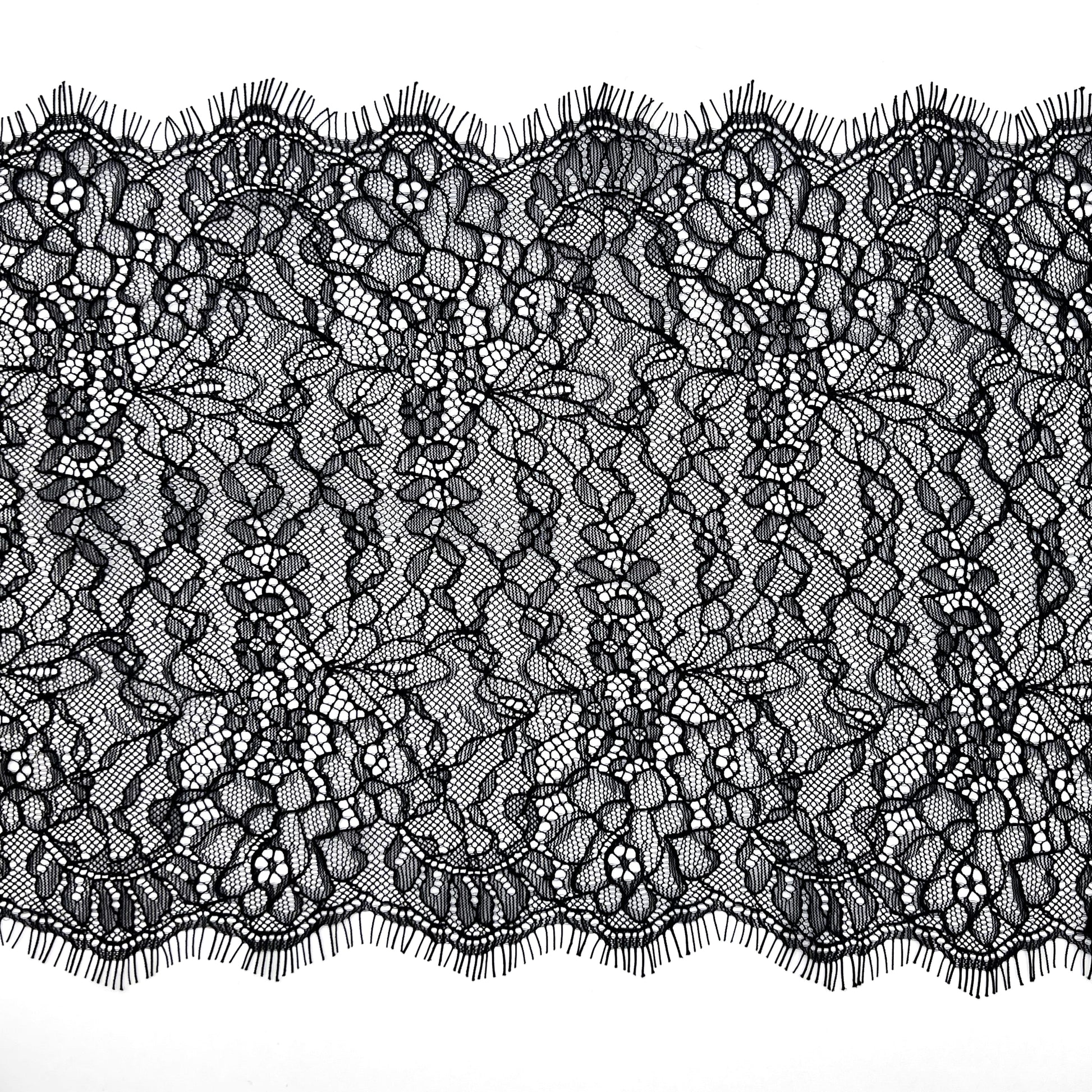 Black Chantilly lace, 22 cm wide, featuring an intricate floral pattern, ideal for lingerie sewing, decorative trims, and craft projects.