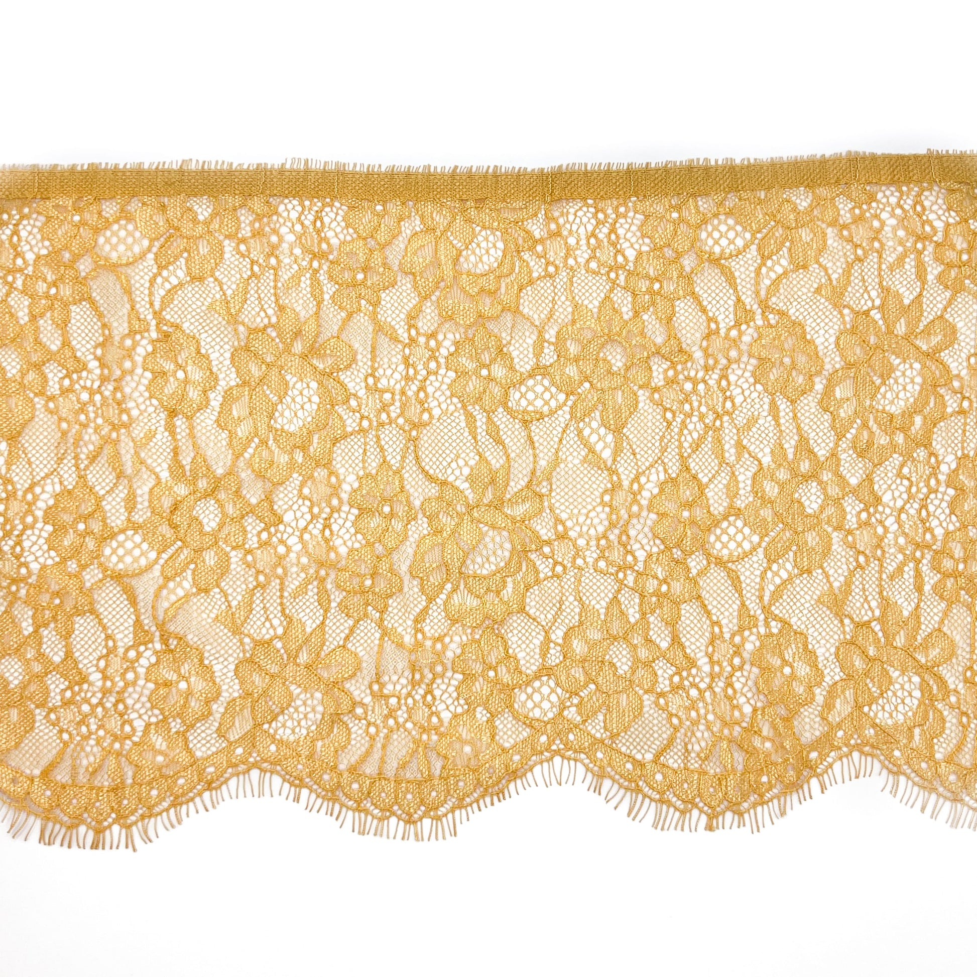 Mustard yellow Chantilly lace, 18 cm wide, featuring an elegant floral pattern, ideal for sewing lingerie, apparel embellishments, and creative DIY projects.