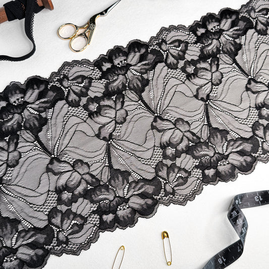 Black elastic lace trim, 21cm wide, featuring elegant floral patterns, perfect for luxury lingerie sewing projects.