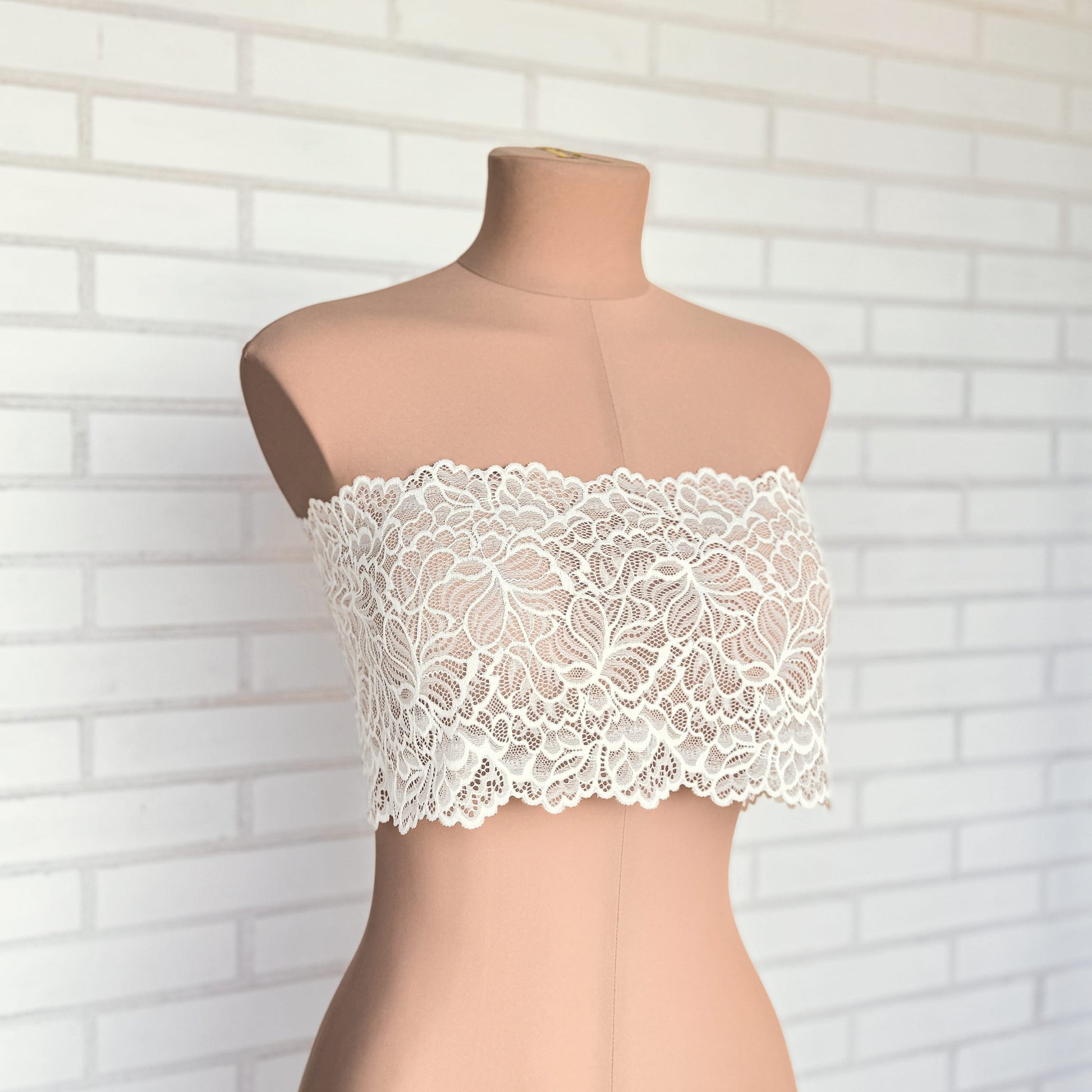 Mannequin styled with milk-colored lace trim, showcasing 20cm width and detailed patterns for premium lingerie projects.
