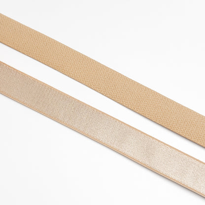 Two beige straps on a white background