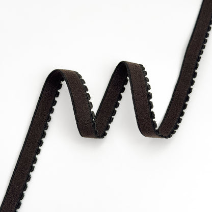 Close-up of a brown elastic with a white background