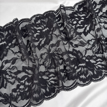 Close-up of black lace fabric on a white background