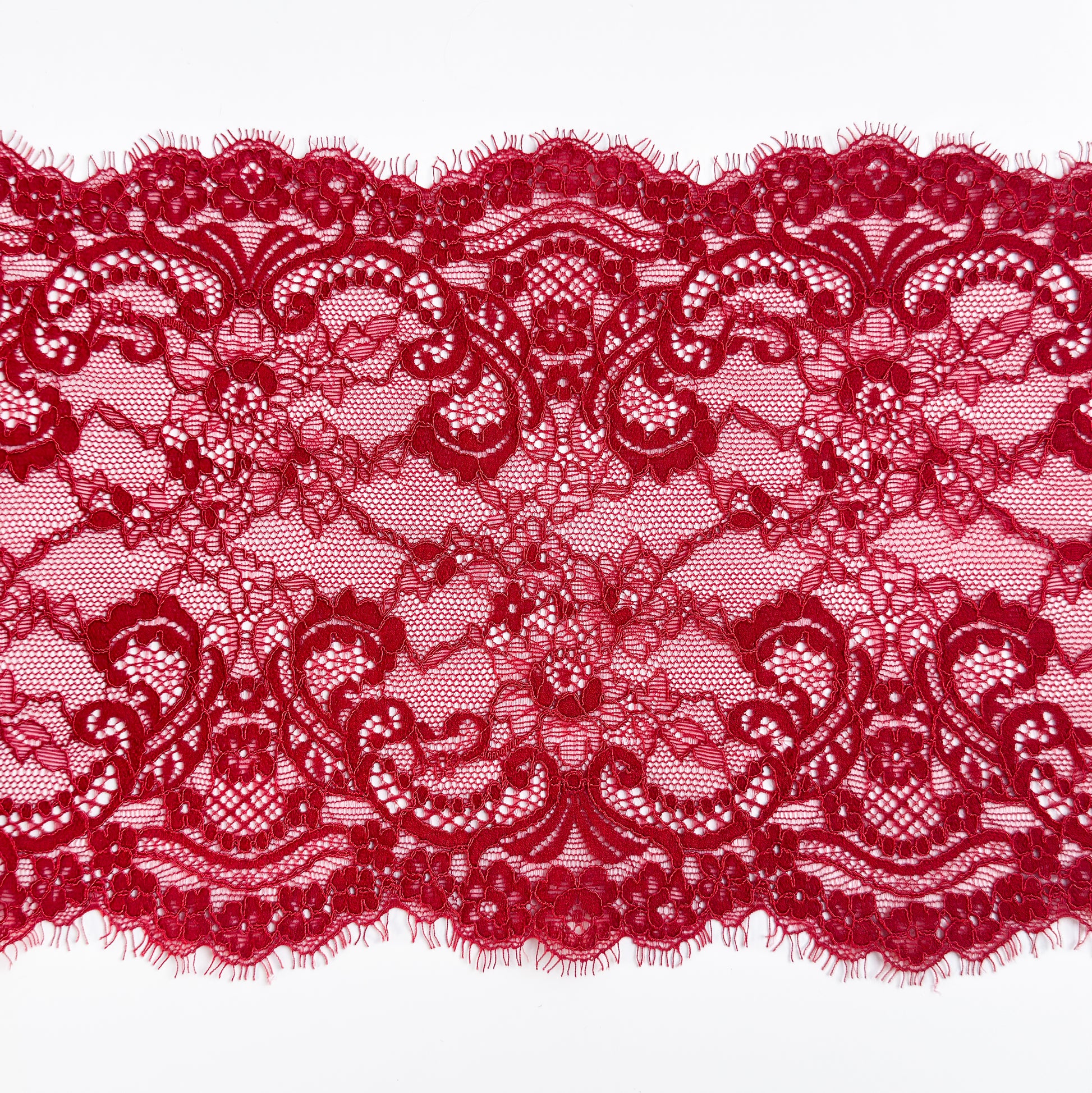 Dark Red lace fabric on a white background